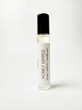 Roll-on bottle labeled 'Honey Dipped' on a white background
