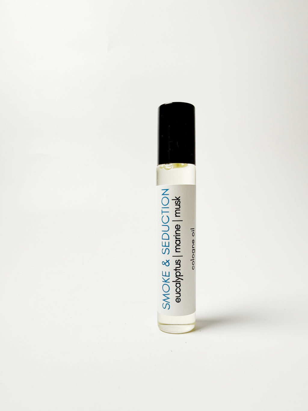 Roll-on bottle of 'Smoke & Seduction' cologne oil on a white background